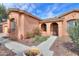 Inviting entrance featuring stone pathway and beautiful desert landscaping at 19973 N Monte Ln, Maricopa, AZ 85138