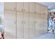 Garage features floor-to-ceiling cabinets for maximum storage at 19973 N Monte Ln, Maricopa, AZ 85138