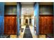 A well-maintained locker room featuring wood lockers, mirrors, and a seating area for residents at 19973 N Monte Ln, Maricopa, AZ 85138