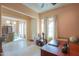 Bright office space with a large window and tile flooring at 19973 N Monte Ln, Maricopa, AZ 85138
