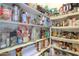 Walk-in pantry with rows of shelving, ideal for storing food and kitchen supplies at 19973 N Monte Ln, Maricopa, AZ 85138
