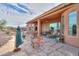 Spacious covered patio with outdoor seating and desert views at 19973 N Monte Ln, Maricopa, AZ 85138