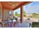 Covered patio with ceiling fan and views of desert landscaping at 19973 N Monte Ln, Maricopa, AZ 85138