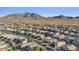 An aerial view of the residential area, with mountain views and a clear sky at 2009 E Lindrick Dr, Gilbert, AZ 85298