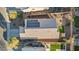 Aerial view of single-Gathering home featuring a solar panel roof and a cozy backyard at 2009 E Lindrick Dr, Gilbert, AZ 85298