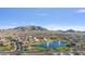 An overhead view of the residential area, with a peaceful pond at 2009 E Lindrick Dr, Gilbert, AZ 85298