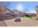 A vibrant backyard with synthetic grass, desert landscaping and hot tub at 2009 E Lindrick Dr, Gilbert, AZ 85298