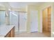 Bright bathroom with a glass-enclosed shower and tile flooring at 2009 E Lindrick Dr, Gilbert, AZ 85298