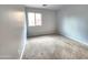 Carpeted bedroom with a window provides natural light and comfortable living space at 2009 E Lindrick Dr, Gilbert, AZ 85298