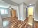 Bonus room featuring modern laminate wood floors, light grey walls, and a ceiling fan at 2009 E Lindrick Dr, Gilbert, AZ 85298