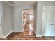 Entryway with hardwood floors leads to the kitchen, living spaces, and bedrooms at 2009 E Lindrick Dr, Gilbert, AZ 85298