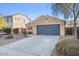 Cozy single-story home featuring neutral stucco, a two-car garage, desert landscaping, and an American flag at 2009 E Lindrick Dr, Gilbert, AZ 85298