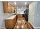 Bright kitchen with wood cabinets, quartz countertops, and stainless steel appliances at 2009 E Lindrick Dr, Gilbert, AZ 85298