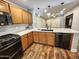 Beautiful kitchen with wood cabinets, stainless steel appliances, and a large island with a white countertop at 2009 E Lindrick Dr, Gilbert, AZ 85298