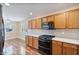 Updated kitchen featuring stainless steel appliances, quartz countertops, and wood floors at 2009 E Lindrick Dr, Gilbert, AZ 85298