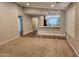 Open concept living space with wood-look floors, leading into a spacious kitchen and dining area at 2009 E Lindrick Dr, Gilbert, AZ 85298