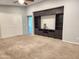 Inviting living area with a built-in media center, offering functionality and style at 2009 E Lindrick Dr, Gilbert, AZ 85298