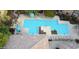 Aerial view of a community pool featuring well-placed seating, landscaping, and tiled rooftops at 20100 N 78Th Pl # 2210, Scottsdale, AZ 85255