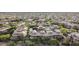 Aerial view of a residential neighborhood featuring many houses with tile roofs surrounded by desert vegetation at 20100 N 78Th Pl # 2210, Scottsdale, AZ 85255