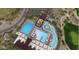 Aerial view of community pool complex featuring pools, lazy river, water slides, lounge area, and landscaping at 20100 N 78Th Pl # 2210, Scottsdale, AZ 85255