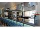Sleek bar with granite countertops, stainless steel appliances, and stylish seating at 20100 N 78Th Pl # 2210, Scottsdale, AZ 85255