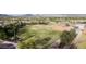 The baseball field is a well-maintained green with mountains in the background on a bright day at 20100 N 78Th Pl # 2210, Scottsdale, AZ 85255