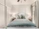 Bright bedroom featuring a four-poster bed, ceiling fan, and stylish decor at 20100 N 78Th Pl # 2210, Scottsdale, AZ 85255