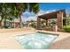 Secluded hot tub surrounded by lush greenery, lounge seating, and mature trees at 20100 N 78Th Pl # 2210, Scottsdale, AZ 85255