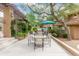 Outdoor dining area with grills, tables, lush landscaping, and inviting atmosphere at 20100 N 78Th Pl # 2210, Scottsdale, AZ 85255