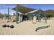 Community playground featuring a slide, climbing structure, covered shade and a sand base for safety at 20100 N 78Th Pl # 2210, Scottsdale, AZ 85255