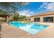 Inviting pool with comfortable seating, umbrellas, and manicured landscaping for resident enjoyment at 20100 N 78Th Pl # 2210, Scottsdale, AZ 85255