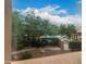 Scenic pool area with lush landscaping, lounge chairs, and a clear blue sky at 20100 N 78Th Pl # 2210, Scottsdale, AZ 85255