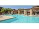 Community swimming pool featuring stone water features and meticulous landscaping, inviting residents to relax and enjoy at 20100 N 78Th Pl # 2210, Scottsdale, AZ 85255