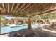 Relaxing pool area with shaded seating, picnic tables, and meticulously maintained landscaping for residents at 20100 N 78Th Pl # 2210, Scottsdale, AZ 85255