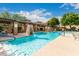 Beautiful pool with stone accents, lounge seating, and well-maintained landscaping at 20100 N 78Th Pl # 2210, Scottsdale, AZ 85255