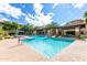Resort-style pool with waterfall features, comfortable seating, and well-maintained landscaping for relaxation at 20100 N 78Th Pl # 2210, Scottsdale, AZ 85255