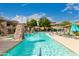 Inviting community pool with clear blue water, lounge chairs, and verdant landscaping at 20100 N 78Th Pl # 2210, Scottsdale, AZ 85255