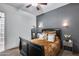 Cozy bedroom with a dark accent wall, plush bedding, and warm lighting for a comfortable atmosphere at 20125 E Via Del Rancho --, Queen Creek, AZ 85142