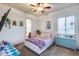 Inviting bedroom with a plush bed, pastel accents, and a bright window with a view at 20125 E Via Del Rancho --, Queen Creek, AZ 85142
