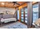 Bedroom showcasing wood ceilings, neutral walls, and doors to the outdoor entertainment space at 20125 E Via Del Rancho --, Queen Creek, AZ 85142