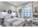Bright bedroom with shiplap walls, window, and decor, creating a cozy retreat at 20125 E Via Del Rancho --, Queen Creek, AZ 85142