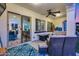 Relaxing covered patio with cozy seating, ceiling fan, and sliding glass doors offering views of the outdoor living space at 20125 E Via Del Rancho --, Queen Creek, AZ 85142