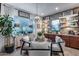 Cozy breakfast nook with a round table, decorative chandelier, and charming window details at 20125 E Via Del Rancho --, Queen Creek, AZ 85142