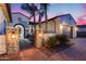Stunning home exterior with desert landscaping, a brick driveway, and a charming courtyard at 20125 E Via Del Rancho --, Queen Creek, AZ 85142