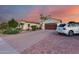 Charming home with a well-manicured lawn, desert landscaping, and a brick-paved driveway at 20125 E Via Del Rancho --, Queen Creek, AZ 85142