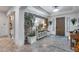 Foyer features decorative stone wall, tiled flooring, and a rustic table with modern lamps at 20125 E Via Del Rancho --, Queen Creek, AZ 85142