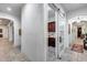 Elegant hallway with a barn door leading to a laundry room or pantry with cabinetry at 20125 E Via Del Rancho --, Queen Creek, AZ 85142