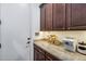 Butlers pantry with granite countertop and custom cabinets for storage and small appliances at 20125 E Via Del Rancho --, Queen Creek, AZ 85142