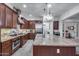 Gourmet kitchen boasts granite counters, stainless appliances, and custom cabinets at 20125 E Via Del Rancho --, Queen Creek, AZ 85142