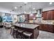 Open kitchen with stone backsplash, stainless steel appliances, and large island with seating at 20125 E Via Del Rancho --, Queen Creek, AZ 85142
